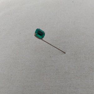 Sharon: N.Y.C. Rogff stick pin with green glass stone.